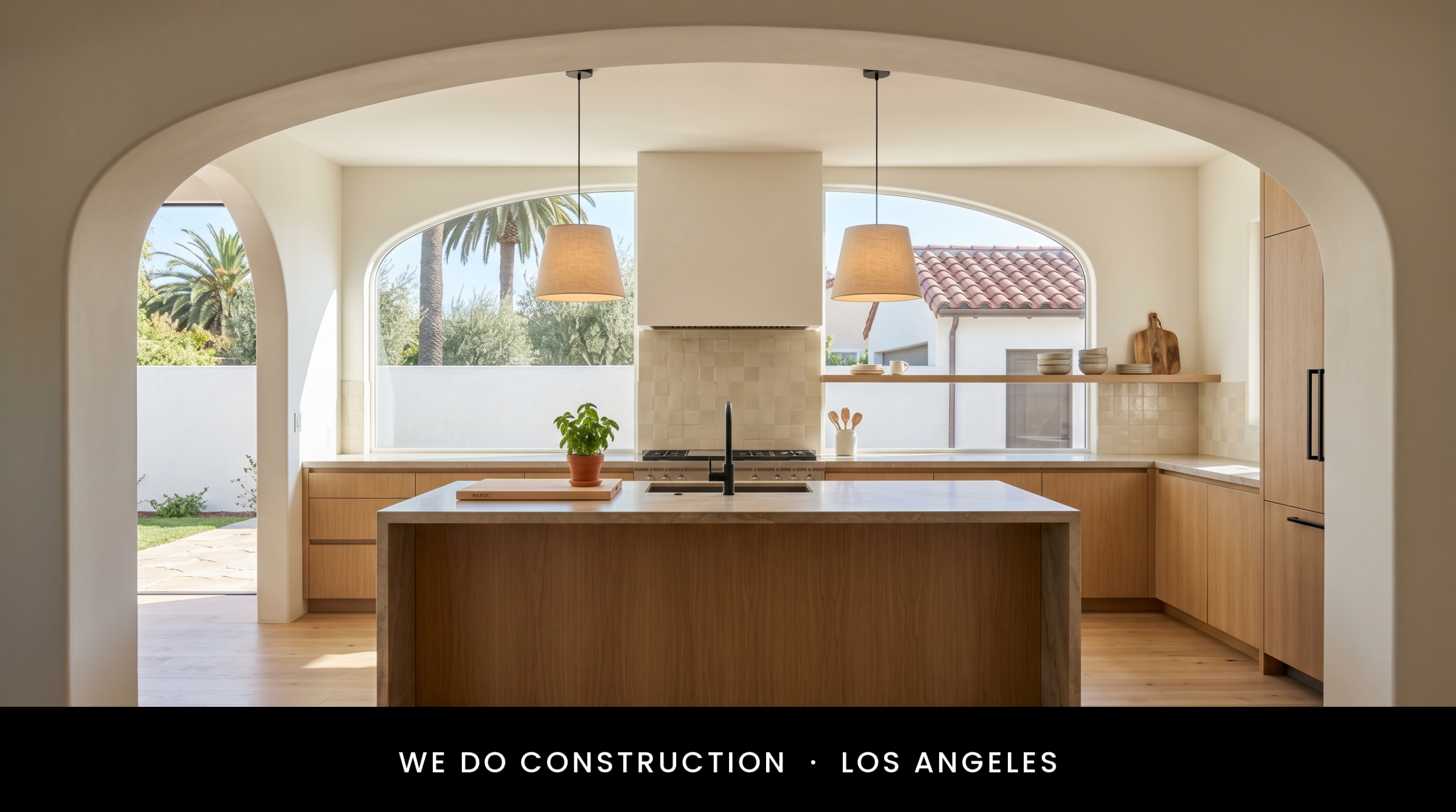 Arched volume + palms + terra-cotta tile beyond — Beverly Hills kitchen register.