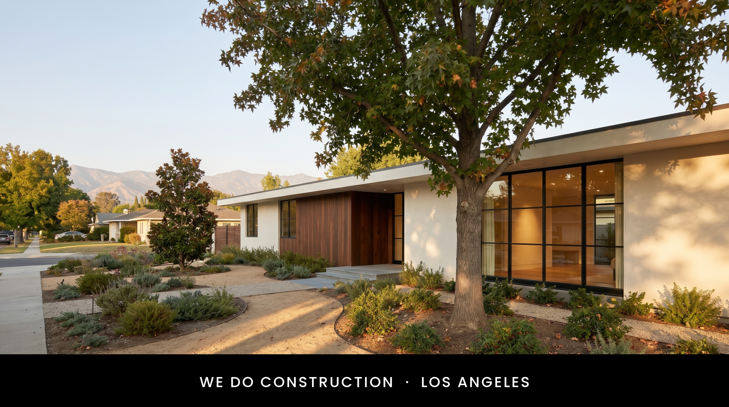Mid-century ranch profile against valley hills — wood, steel, stone discipline.